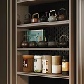 Traditional Tea Set Display On Wooden Shelf With Assorted Teapots And Tea Cans