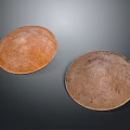 Two Traditional Brown Handwoven Straw Hats With Natural Textured Design