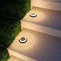 Modern Outdoor Recessed Wall Light Design Illuminating Garden Steps with Green Shrubs
