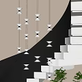 Modern Multiple Pendant Lights Hanging In Staircase With Geometric Wall And Green Plant
