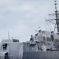 Military Warship Cannon Firing With Flames And Smoke At Sea Surface