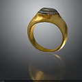 Vintage Gold Fashion Accessory Ring With Textured Band And Blue Brown Stone On Top