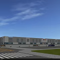 Modern Industrial Factory Building With Large Glass Windows Parking Area And Green Landscaped Surroundings