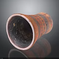 Red Patterned Ceramic Clay Pot With Dark Interior On Shiny Reflective Surface
