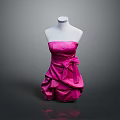 Pink Strapless Ruffled Dress With Bow Accent Displayed On White Mannequin