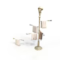 Gold Floor Standing Towel Rack With Multiple Bars Hanging Towels And Small Holder