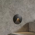 Modern Black Circular Wall Light Installed On Concrete Wall With Warm Glow 3d model