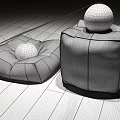 Leather Ottoman Furniture with Brown and Black Design and Decorative Balls on Wooden Floor