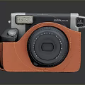 Instax Mini 12 Instant Camera In Orange Leather Case With Round Lens And Portable Design