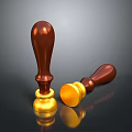 Two Household Seal Stamps with Wooden Handles Gold Bases Standing Upright and Lying