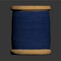 Wooden Spool Of Blue Thread For Daily Sewing And Craft Use
