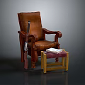Brown Leather Lounge Chair With Wooden Armrests And Footstool Topped With Book