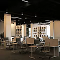 Modern Public Office Space With Open Layout Desk Chairs And Natural Light
