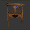 Round Top Orange Wooden Table With Unique Carved Legs And Blue Decorative Accents