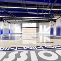 Modern Indoor Basketball Court Interior Featuring Hoops And Branded Elements