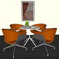 Modern Interior Space With Round White Table And Orange Chairs Metal Legs Wall Art And Potted Plant