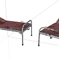 Two Rustic Single Beds With Metal Frames And Red Mattresses