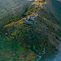 Stunning Mountain Landscape With Ancient Castle Lush Green Forest And Flowing River
