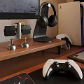 Entertainment Room With Computer Monitor Headphones Game Controller Laptop Game Console And Small Figurines