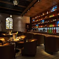 Cozy Bar Interior Design With Stained Glass Window Wooden Shelves Bottles And Leather Chairs