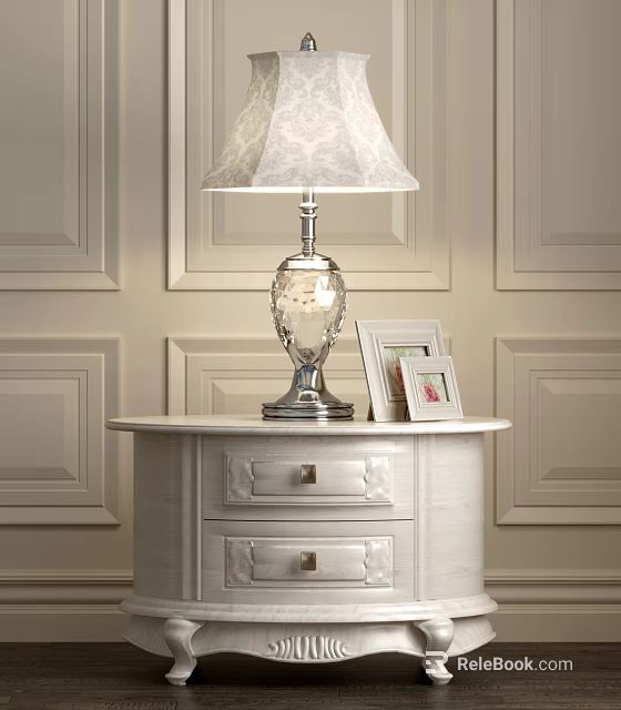 Lace Shade Lamp with Silver Base on White Nightstand and Photo Frames Against Paneled Walls 3d model 