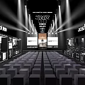 Professional Stage Setup With Bright Lighting Seats And Brand Display Screens
