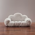 Light Gray Cloud Shaped Lazy Sofa On Wooden Floor With Neutral Wall