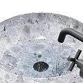 Transparent Textured Crystal Washbasin With Black Wall Mounted Faucet And Flowing Water