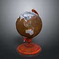 Brown Globe With White Snowy Regions And Red Stand Base