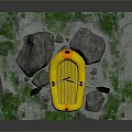 Yellow Inflatable Boat With Paddles On Green Mossy Ground Near Rocks