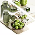 Decorative Ornament Set With Green Glass Vases Cups Wooden Bowl And Fresh Green Apples