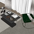 Black coffee table with glass top wooden tray books and green chair in living room