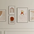 Minimalist Wall Art Display With Framed Paintings And Soft Tones