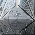 Amusement Park Indoor Attraction With Glass Dome Blue Lighting Reflective Floor And Geometric Frame Design