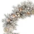 Silver Christmas Wreath With Decorative Balls Warm Lights And Pine Branches