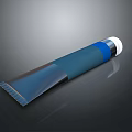 Blue Tube Container With White Cap And Blue Body On Smooth Reflective Surface