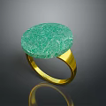 Elegant Green Round Stone Ring With Gold Band And Textured Surface