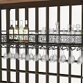 Stylish Wine Cabinet With Wine Bottles And Hanging Wine Glasses On Decorative Metal Rack