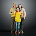 Family Portrait With Parents And Child In Yellow Sweater Standing Together