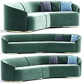 Green Velvet Curved Sectional Sofa With Gold Base And Decorative Pillows