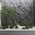 Natural Garden Accent With Gray Rock Wall Green Plants Small Tree And White Pebbles