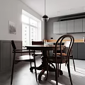 Modern Restaurant Interior With Grey Cabinets Wooden Countertop Round Table Four Chairs Window Pendant Light