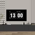 Modern TV Stand With Floor Lamp Green Plant Decorations and TV Displaying Time and Date
