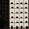 Traditional Tea Pots Display On Multi Layered Shelf With Indoor Plant Decoration