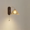 Elegant Wall Lamp With Wooden Base Curved Arm Wavy Glass Shade And Warm Light