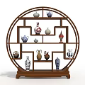 Traditional Circular Wooden Curio Cabinet Displaying Various Vases And Porcelain Art Pieces