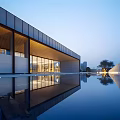 Modern Sales Office Building With Horizontal Glass Facade And Water Surface Reflection
