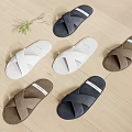 Crisscross Strap Slippers in White Navy and Brown on Wooden Floor with Green Plant