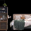 Cozy Double Bed With Plush Pillows Green Blanket Wooden Cabinet And Potted Plant Decor