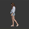 Woman in light blue shirt and denim shorts walking with sunglasses on gray background